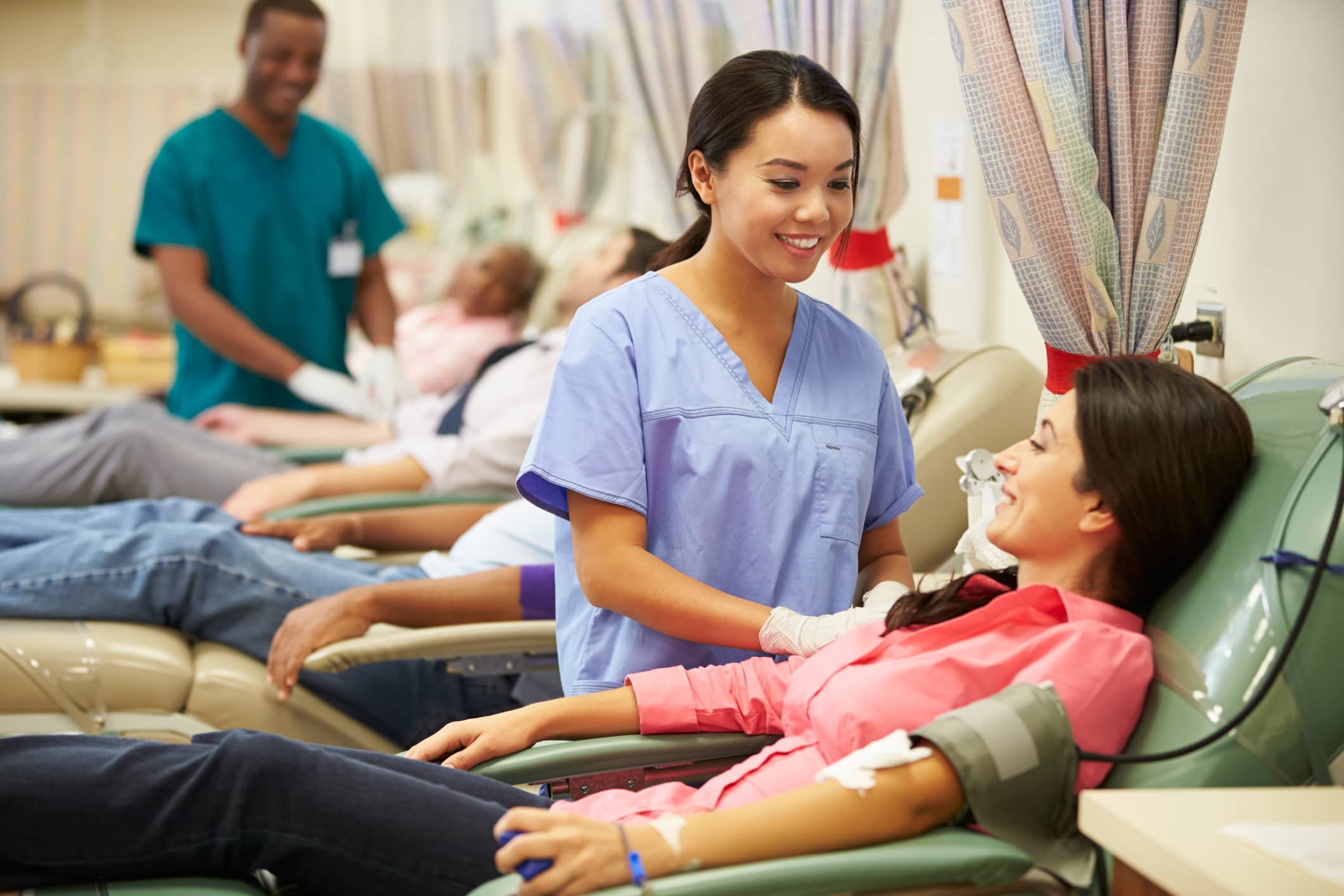 Phlebotomst preparing to draw blood from a patient