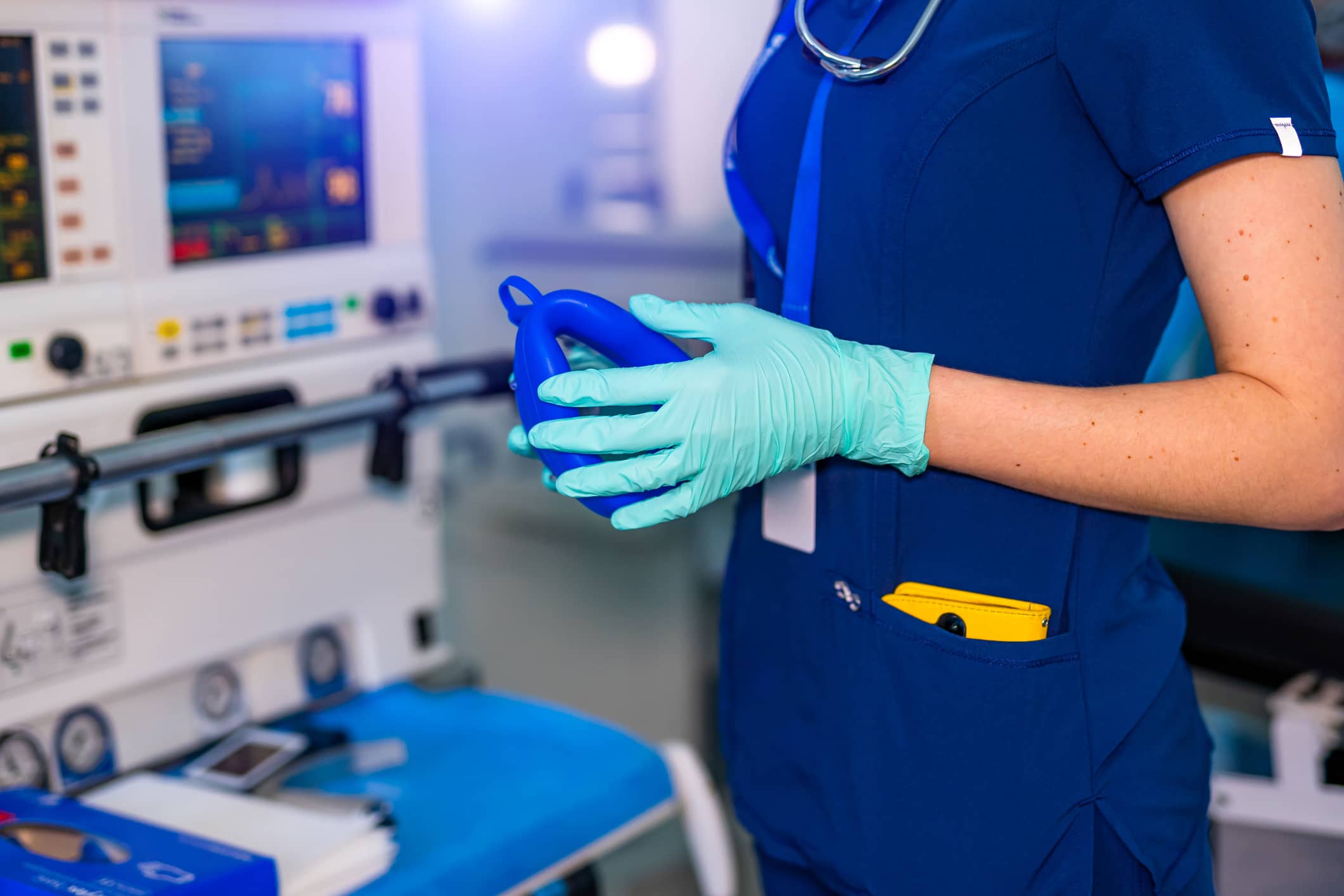 Respiratory therapist standing next to medical equipment